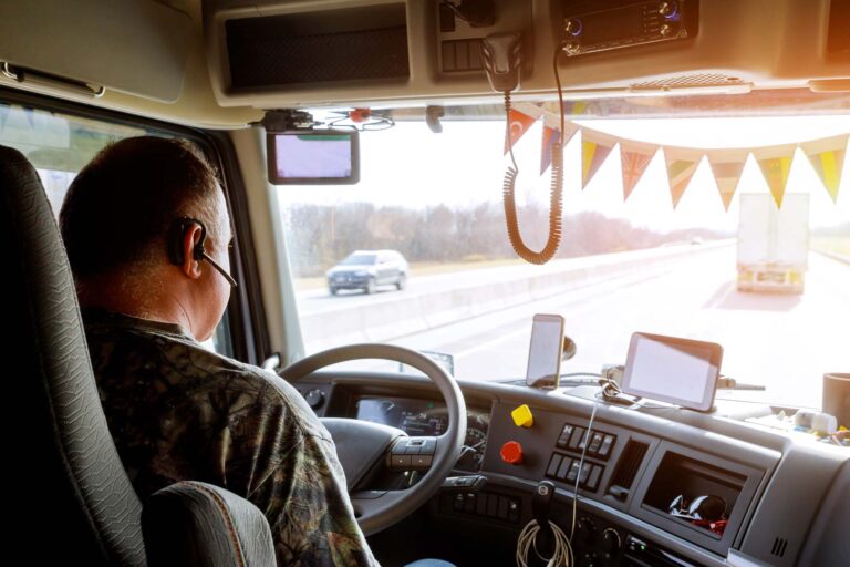 driver-in-cabin-of-big-modern-truck-vehicle-on-hig-2022-11-12-10-36-29-utc